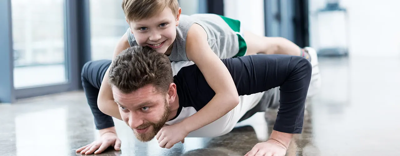 Physical therapist assessing a patient's back